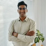 successful-businessman-standing-office-portrait-successful-businessman-smiling-camera-standing-modern-office-356736150 successful-businessman-standing-office-portrait-successful-businessman-smiling-camera-standing-modern-office-356736150